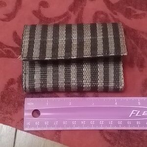 Bifold wallet in two tone rafia stripes from Laura Kirar, blk & tan.